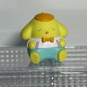 Pompompurin figure from the Sanrio Rocking Horse blind box series by Miniso.